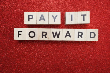 Pay It Forward alphabet letter on red glitter background