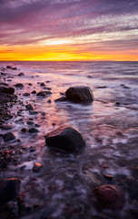 Fototapeta na wymiar Purple sunset over beautiful beach in Wolin National Park, Poland.