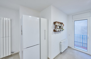 modern white kitchen, there is a mug hanger