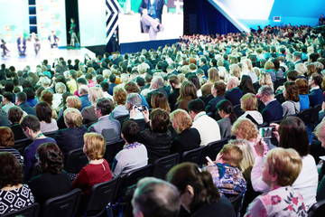 Many people at conference - Powered by Adobe