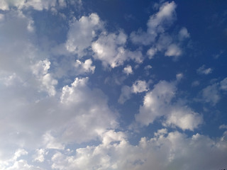 Fantastic soft white clouds against blue sky