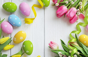 colorful easter eggs and spring flowers