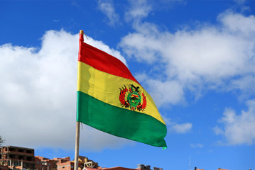 Flag of Bolivia Waving on Vibrant Blue Sky