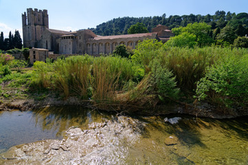 Fototapeta na wymiar Sainte Marie abbey and Orbieu river in Lagrasse village