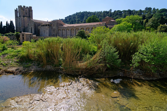 Sainte Marie abbey and Orbieu river in Lagrasse village