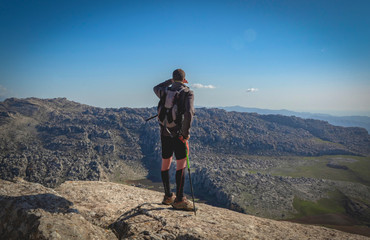 trekking, man looking far away in the torcal de antequera world heritage site, sport in nature,...