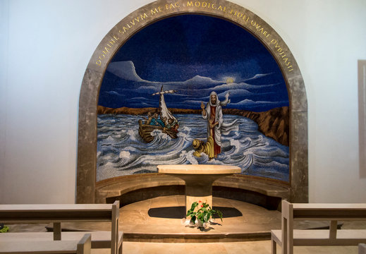 Magdala, Israel, January 26, 2020: Side altar in the church in Magdala on the Galilee Lake (Tiberiacn) with a mosaic depicting Jesus walking on the lake