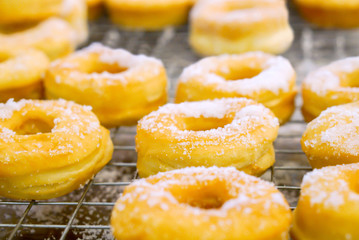 Close up and crop of doughnut with sugar on top.