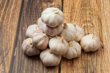 Garlic.Garlic on a wooden background. Vegetarianism.Spices.