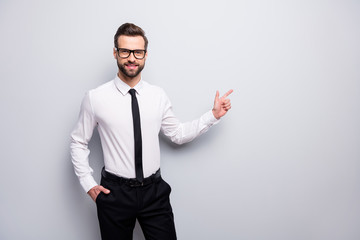 Photo of handsome macho business man smiling friendly agent indicating finger empty space advising...