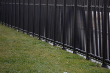 brown painted aluminum iron fence