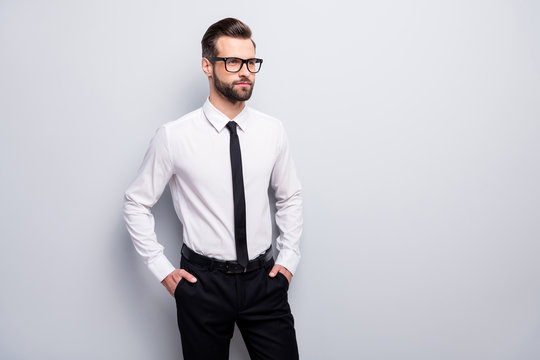 Photo of handsome young macho business man bossy meet colleagues partners  look side empty space wear specs white office shirt black pants tie  isolated grey color background Stock Photo