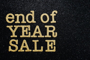 End of Year Sale alphabet letter on black glitter background