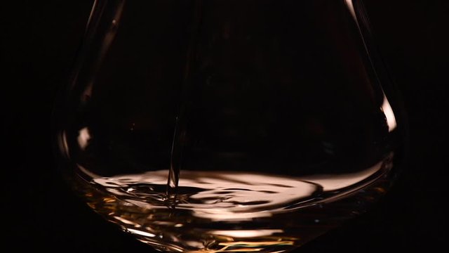 Pouring Italian Grappa Into The Glass