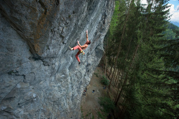 rock climber making a dinamic move