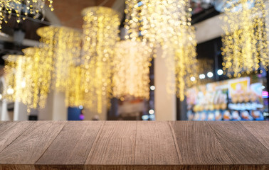 Empty dark wooden table in front of abstract blurred bokeh background of restaurant . can be used for display or montage your products.Mock up for space.