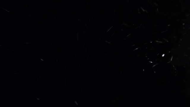 blizzard at night, falling snow on a black background. snowstorm on a cold winter night.