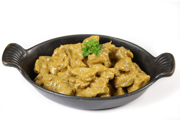 meat cooked in curry and coconut milk