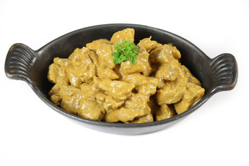 meat cooked in curry and coconut milk