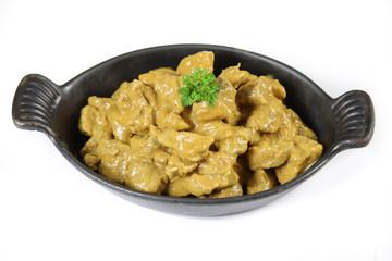 meat cooked in curry and coconut milk