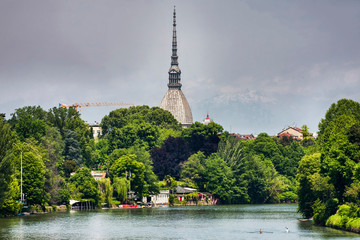 Po river in Turin, the river winds its way through lush vegetation, rowers enjoy good weather, on...