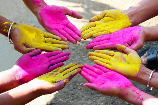 Colored powder on hands.  Holi - the festival of colors