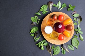 Ingredient mediteranean salad and salad dressing. photo isolate on black top view copy space