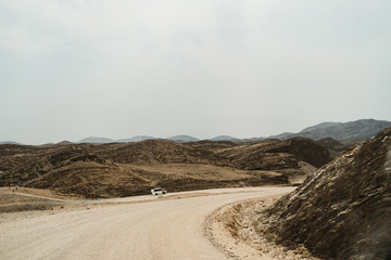 lonely road throug dead moon Landscape with rocks, stones and mountains