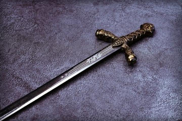 Knight's hilt on a gray marble background