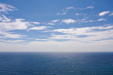 Tropical blue sea and blue sky with clouds.