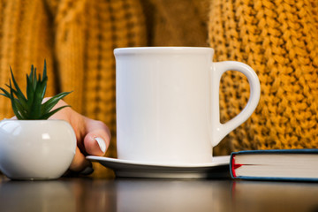 cup of coffee and notebook on table