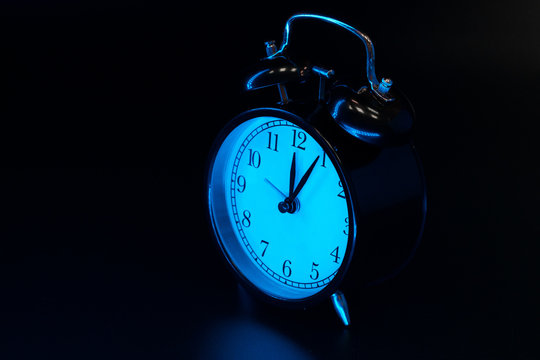 Alarm clock close up on black background
