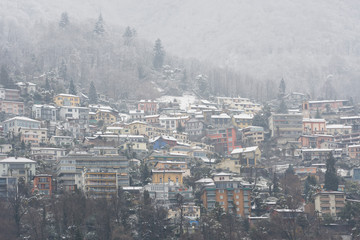 Village in Winter with Snow on the Mountain Side in Switzerland.