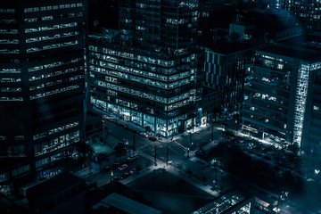 Night buildings with lights and cars at night in Montreal