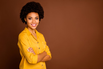 Profile photo of beautiful funny business dark skin curly lady beaming smiling arms crossed good mood reliable worker wear yellow shirt isolated brown color background