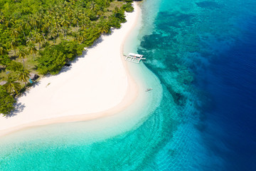 White sand beach and blue sea, view from above . Mahaba Island, Philippines. advertising concept