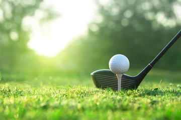 Rolgordijnen Golf clubs and golf balls on a green lawn in a beautiful golf course © Nattawut