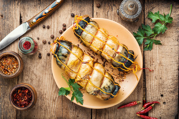 Smoked mackerel on wooden table