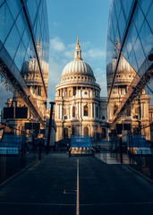 Fototapeta na wymiar St Paul's Cathedral reflected in modern glass buildings, London