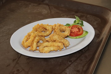 Fried squid flour dishes served on a white plate