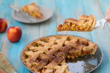 Home-baked lattice apple pie, in a baking dish.