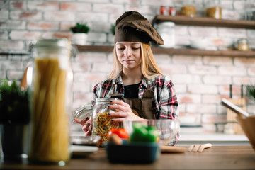 Little girl in kitchen. Cute girl cooking .