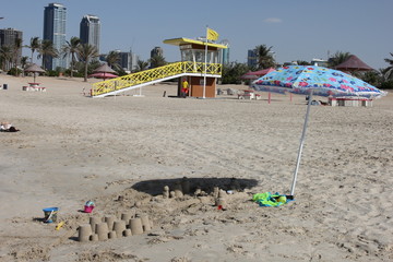 Fototapeta na wymiar beach with umbrellas and lounges