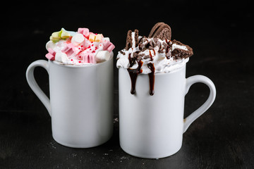 Coffee drink with cream and marshmallow on black