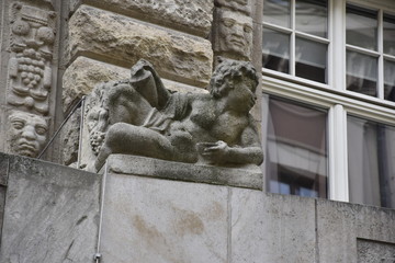 child sculpture made on a building wall