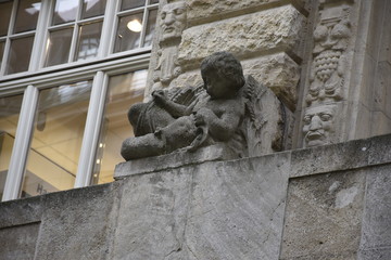 child sculpture made on a building wall