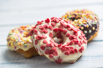 Sweet glazed donuts on table - Close up