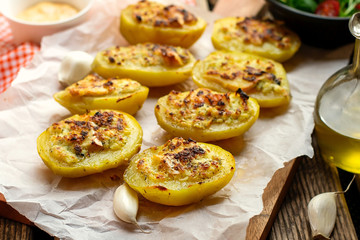Stuffed potato halves with cheese and garlic