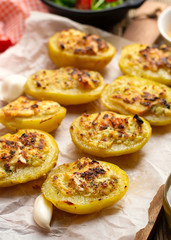 Stuffed potato halves with cheese and garlic