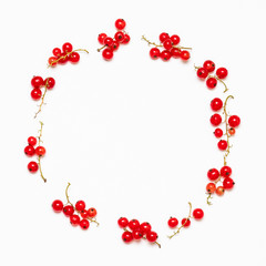 Fruit frame made from red currant berry on a white background